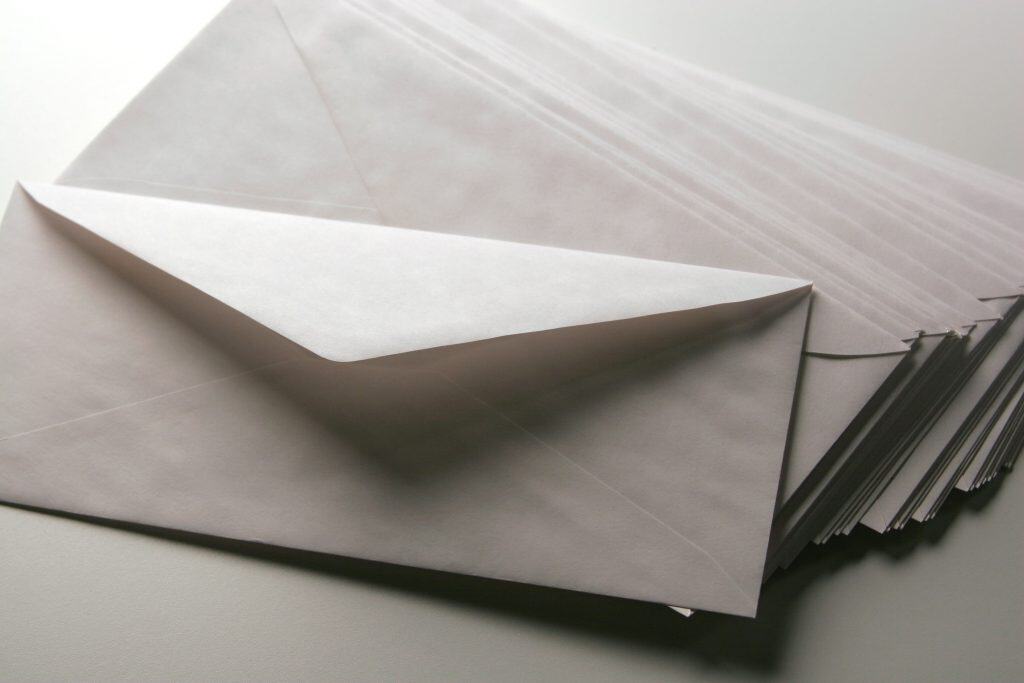 Several,Paper,Envelopers,On,A,Plain,Background